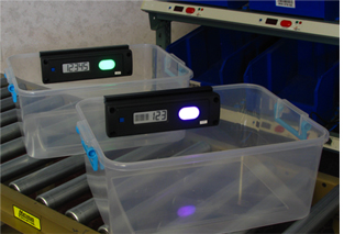Lightning Pick NW Series wireless pick-to-light systems on totes.