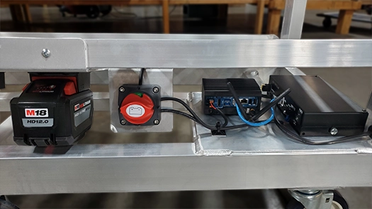 base of pick cart showing the battery systems and wifi controls